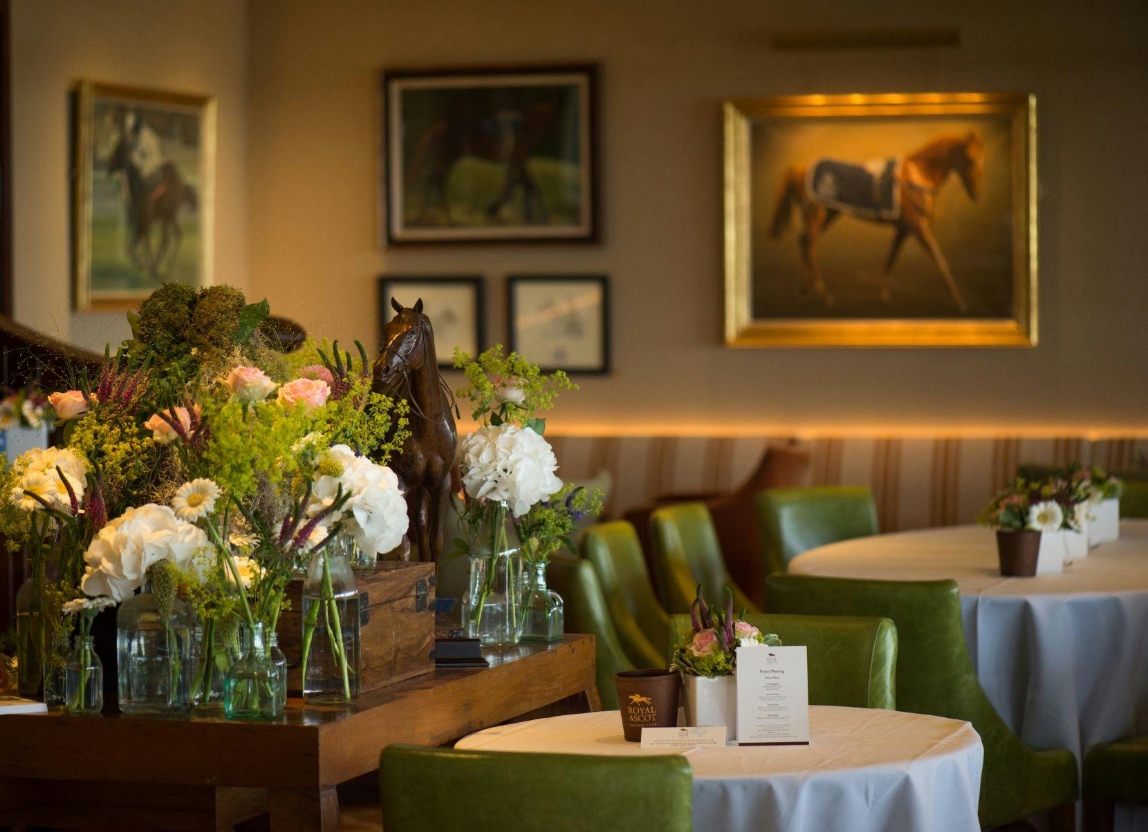 Elegant event space at Royal Ascot with floral centerpieces for upscale gatherings.
