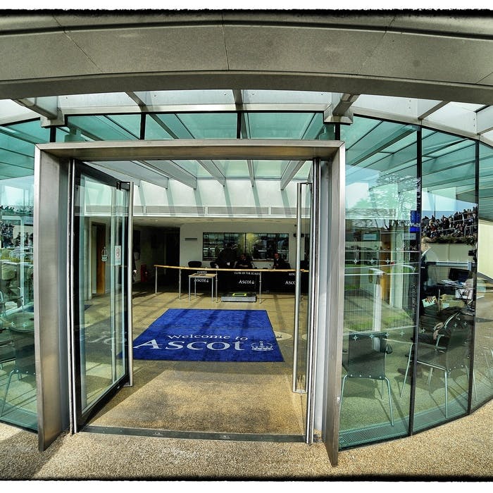 Ascot Racecourse Jockeys' Weighing Room entrance with sleek glass facade, ideal for events.