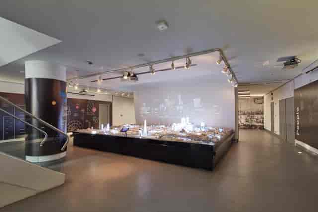 Modern event space with illuminated display, ideal for exhibitions and corporate presentations.