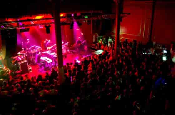Vibrant live music event at Arts Club Liverpool with dynamic lighting and engaged audience.