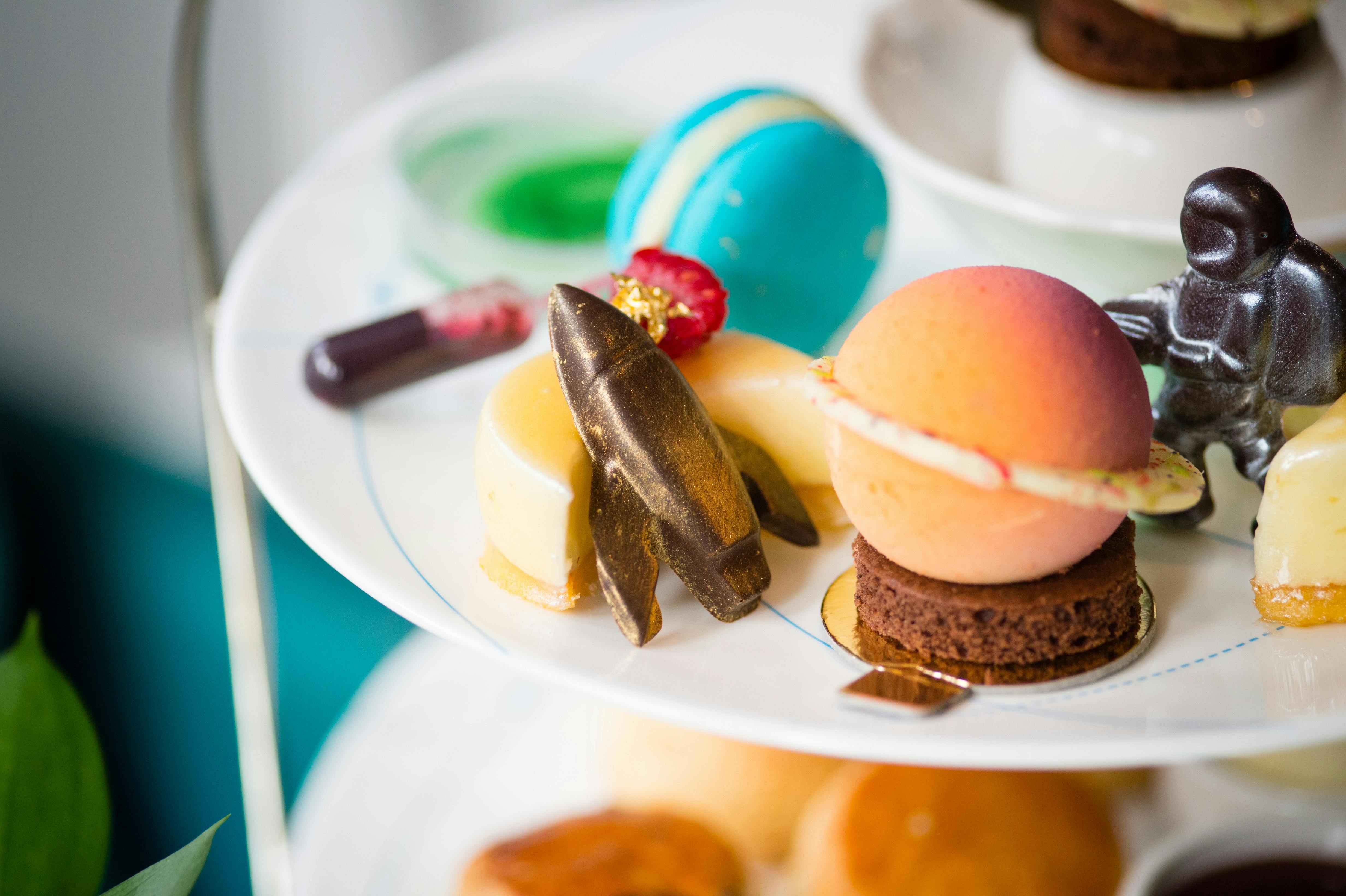 Elegant tiered dessert display at The Ampersand Hotel for a space-themed event.