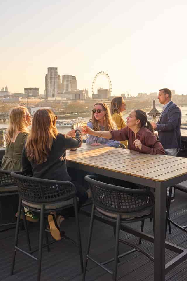 Premium rooftop networking event with London skyline view for corporate delegates.