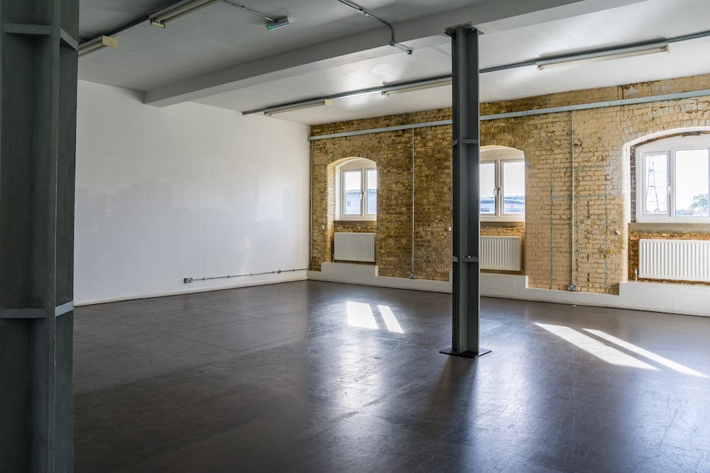 Blue Anchor Studio event space with exposed brick, ideal for workshops and networking.