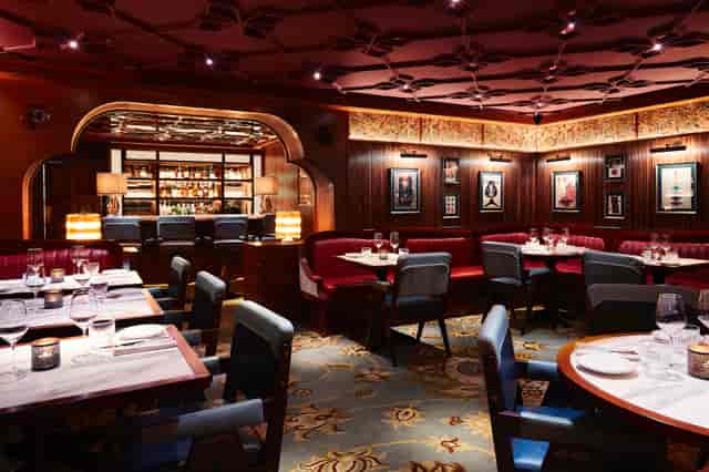 Sophisticated dining space with plush seating for corporate dinners and intimate gatherings.