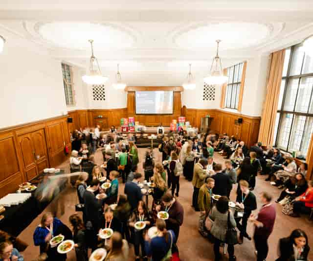 Networking reception in Hoare Memorial Hall, Westminster with high-density standing room layout.