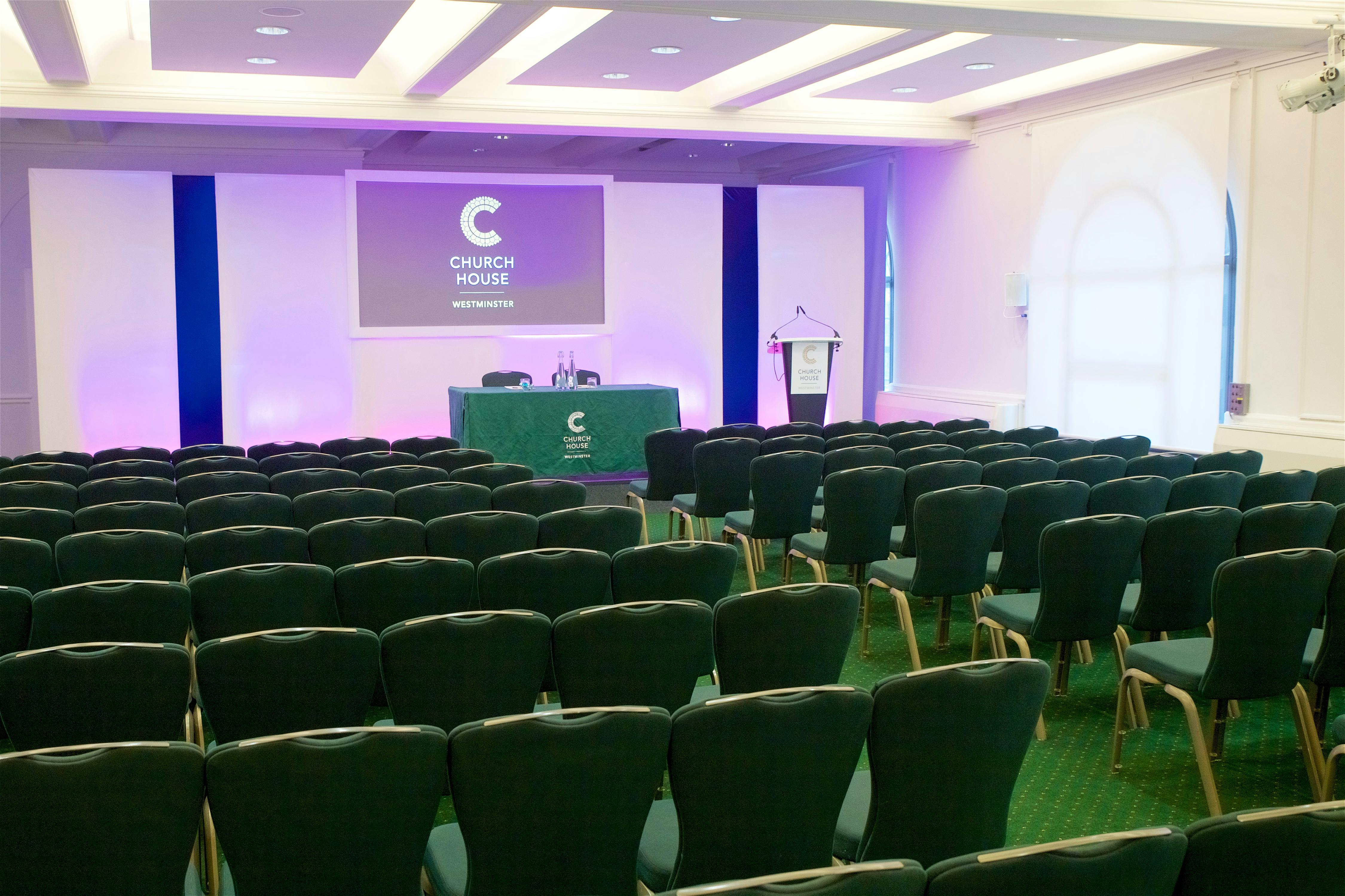 Harvey Goodwin Suite conference room with green chairs for corporate events in Westminster.