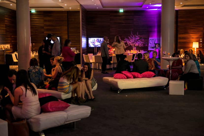 Vibrant ME London event space with stylish seating for networking and social events.