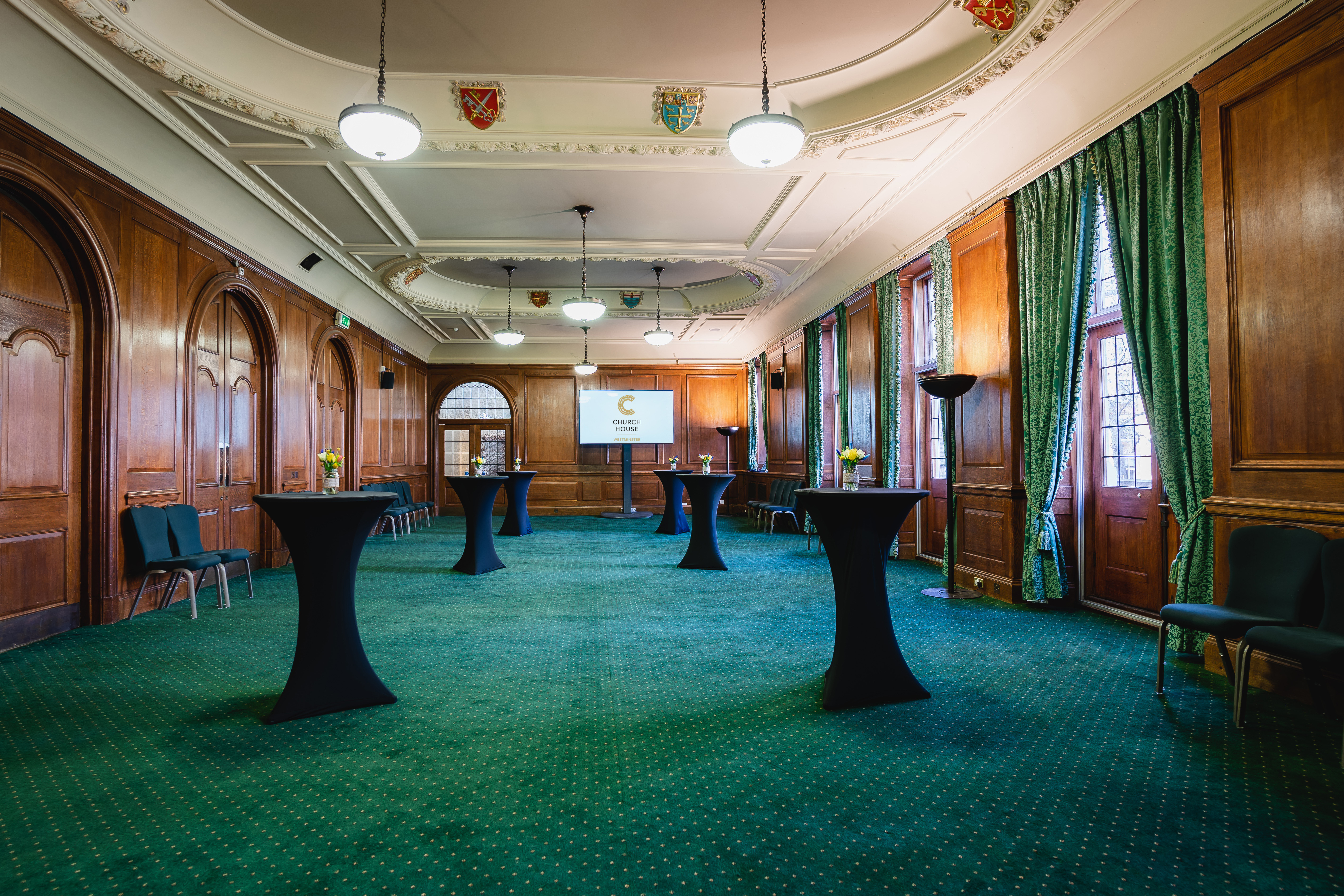Bishop Partridge Hall: elegant event space with wooden paneling for receptions and networking. - Banner