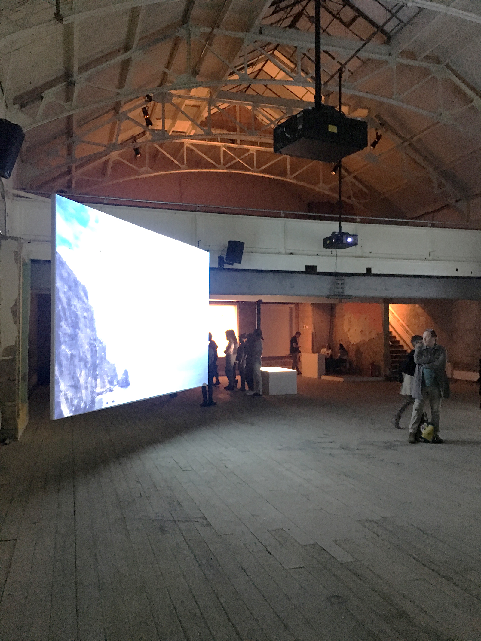 Double Height Auditorium at 133 Rye Lane, spacious industrial venue for events and presentations. - Banner