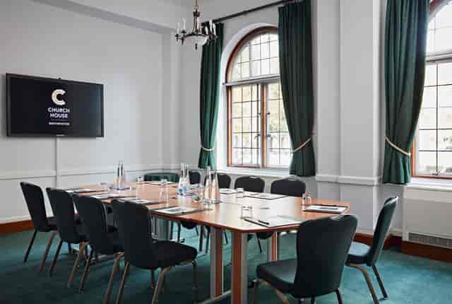 Sir Herbert Baker Room, Church House Westminster, modern meeting space with large screen.