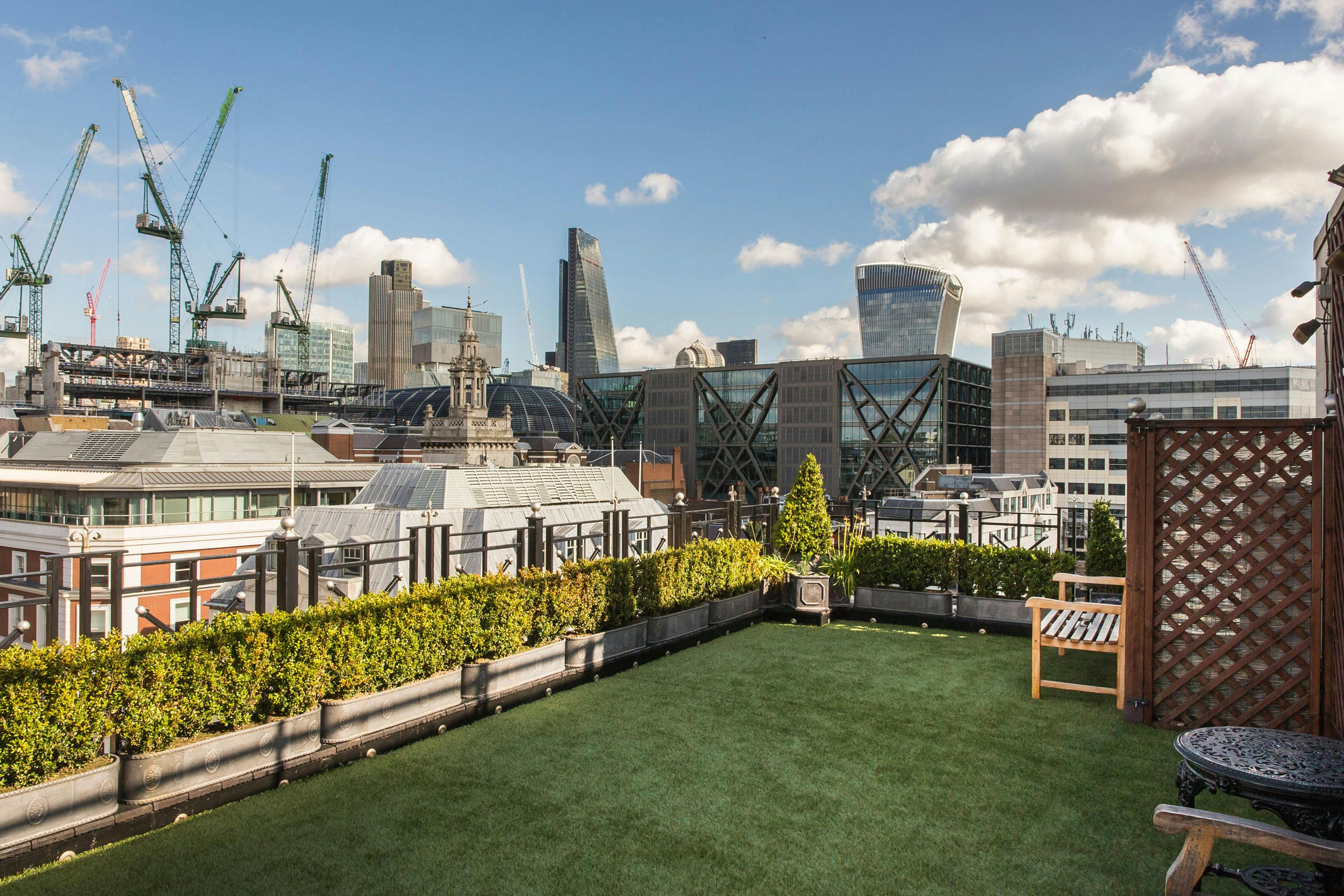 Boardroom at Vintners' Hall: rooftop venue with greenery, perfect for upscale events.