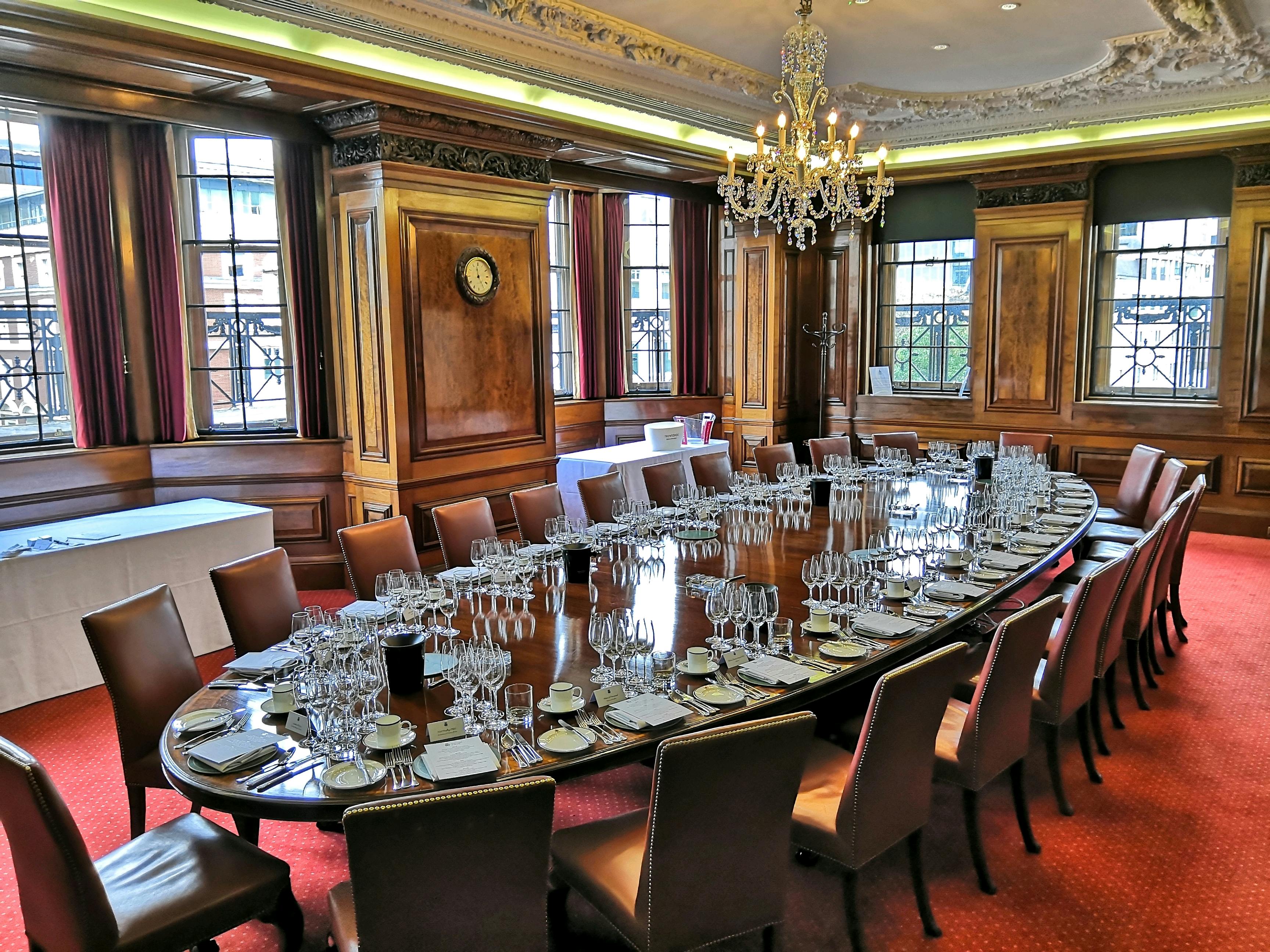 Boardroom at Vintners' Hall with elegant dining setup for formal events.