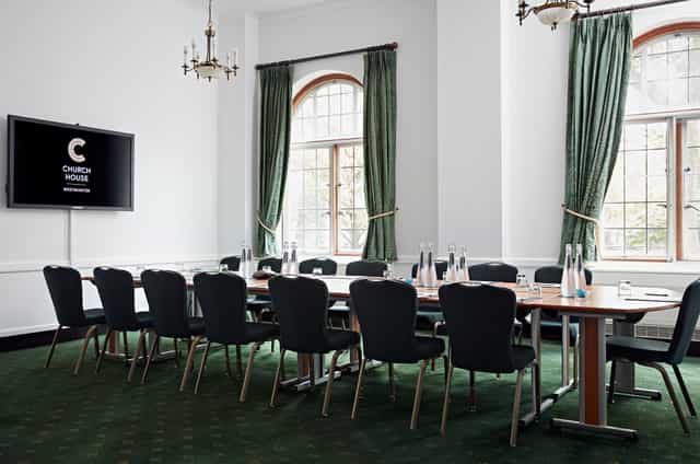 Westminster Room in Church House: elegant meeting space with natural light for corporate events.