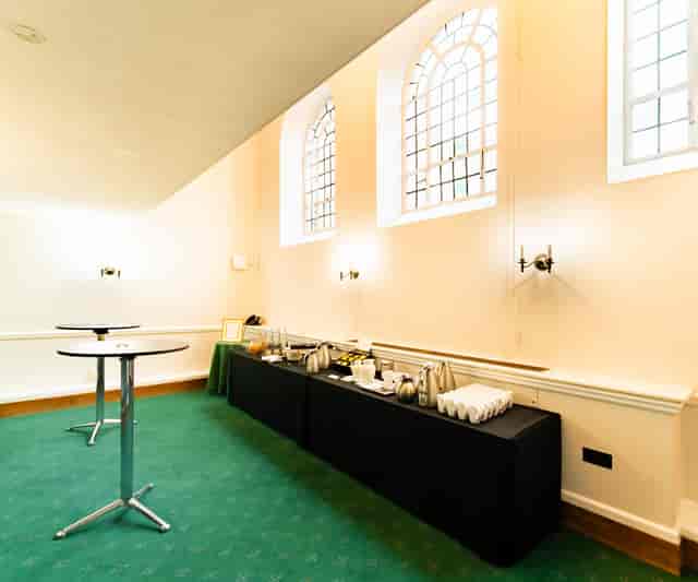 Bishops' Robing Room event setup with buffet and cocktail tables for corporate catering.
