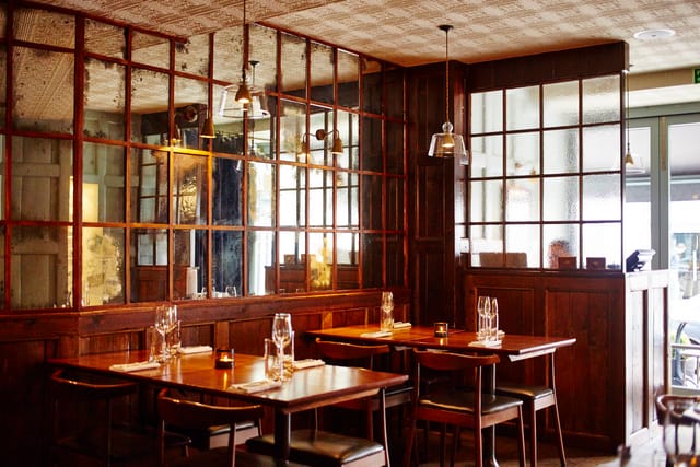 Stylish restaurant interior with warm wood accents, ideal for private events and gatherings.