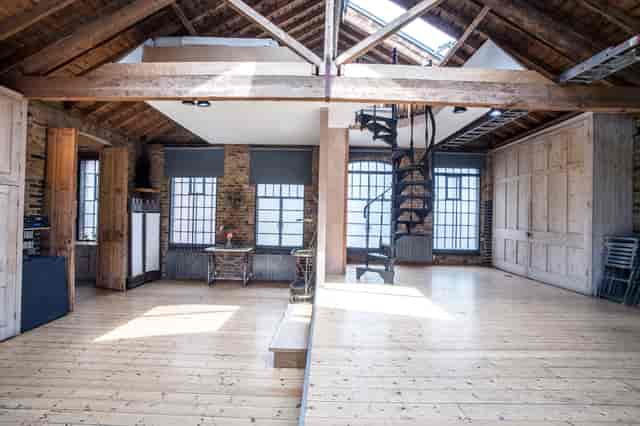 Spacious First Option Location Studio with rustic beams, ideal for workshops and events.