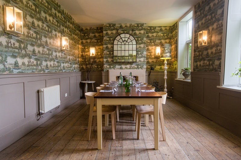 Fly Fishing Room at Stoke Place: rustic meeting space with wooden table for workshops.