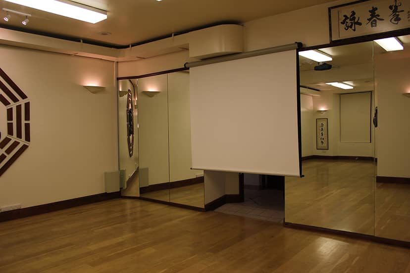 Versatile meeting space with hardwood floors for workshops at Simon Lau Centre.