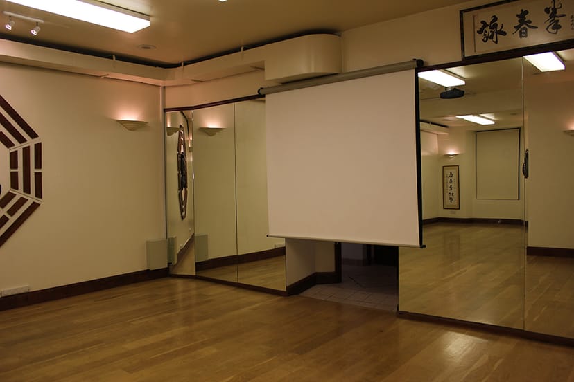 Versatile meeting space with hardwood floors for workshops at Simon Lau Centre.