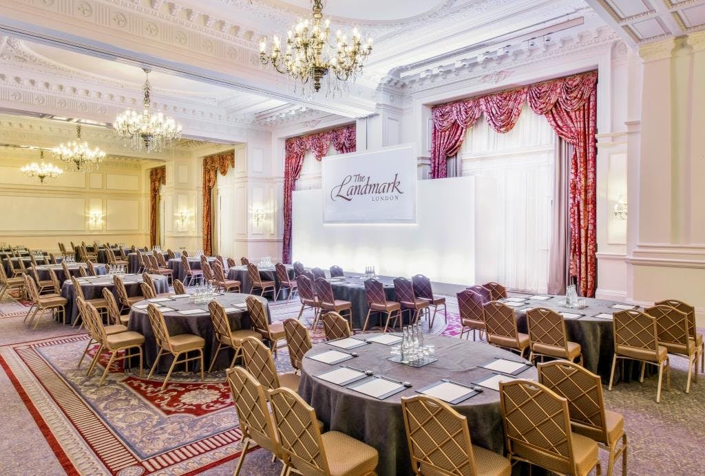 Grand Ballroom at The Landmark London, elegant meeting space with round tables for corporate events.