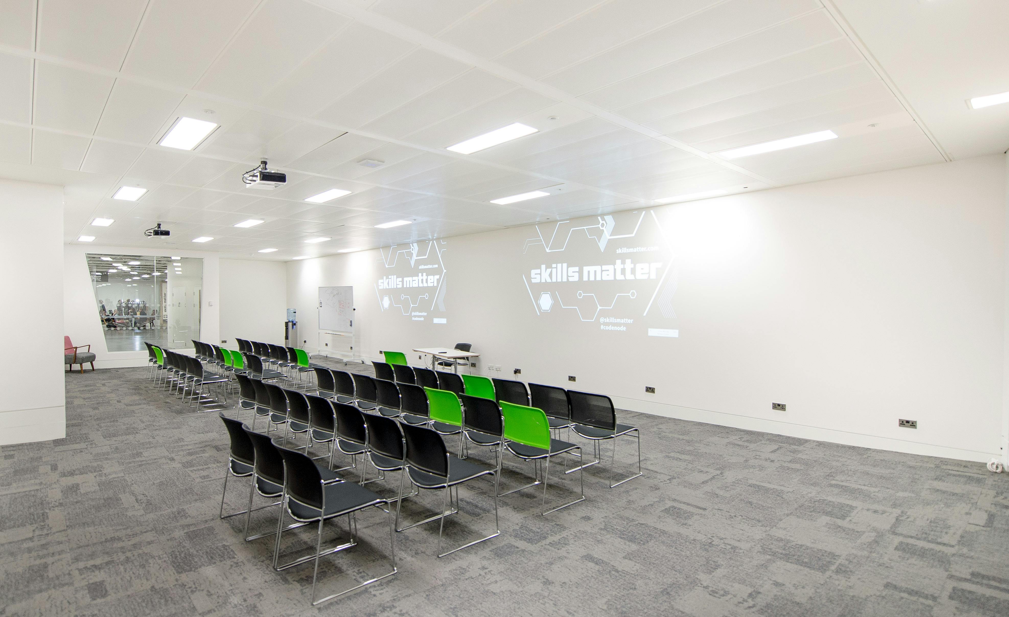 Modern meeting space with sleek chairs, ideal for workshops and seminars.