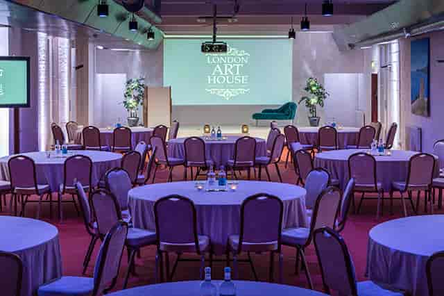 London Art House banquet conference hall with stage for corporate events and gala dinners.