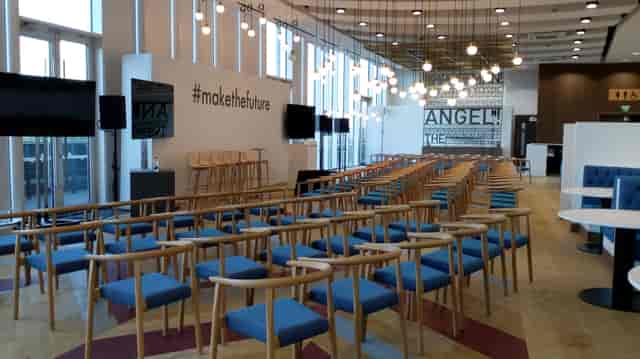 Event space in London Stadium with modern seating for presentations and workshops.