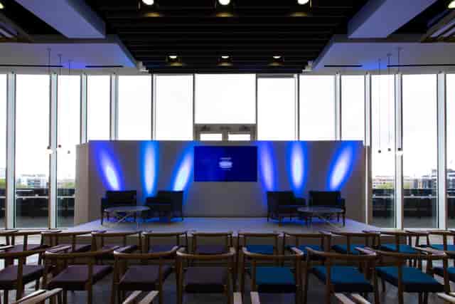Event space at London Stadium with sleek stage, ideal for conferences and panel discussions.