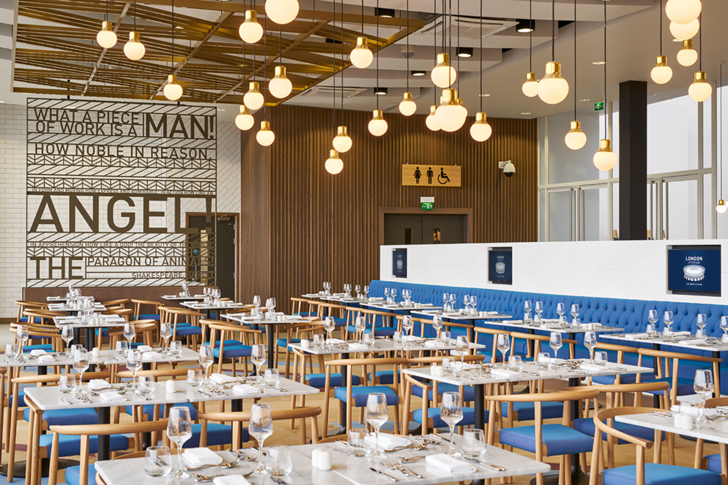 Modern restaurant in London Stadium, ideal for events with stylish decor and warm lighting. - Banner