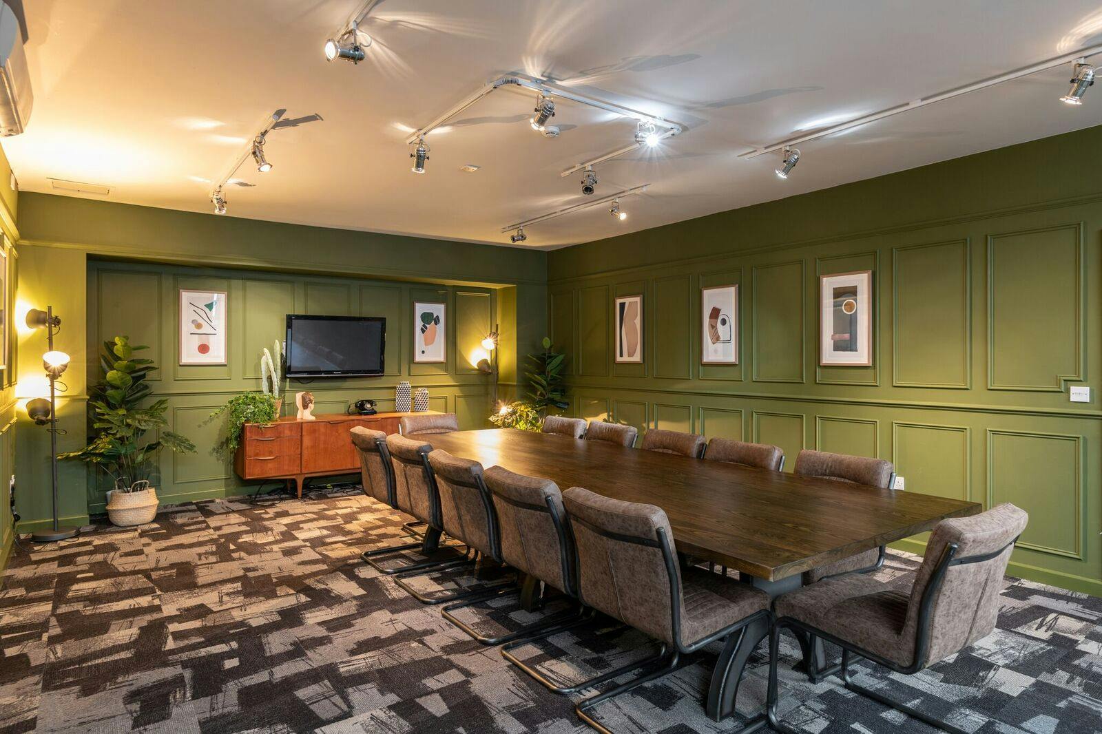 The Social Boardroom at Fazeley Studios with a long wooden table for meetings.