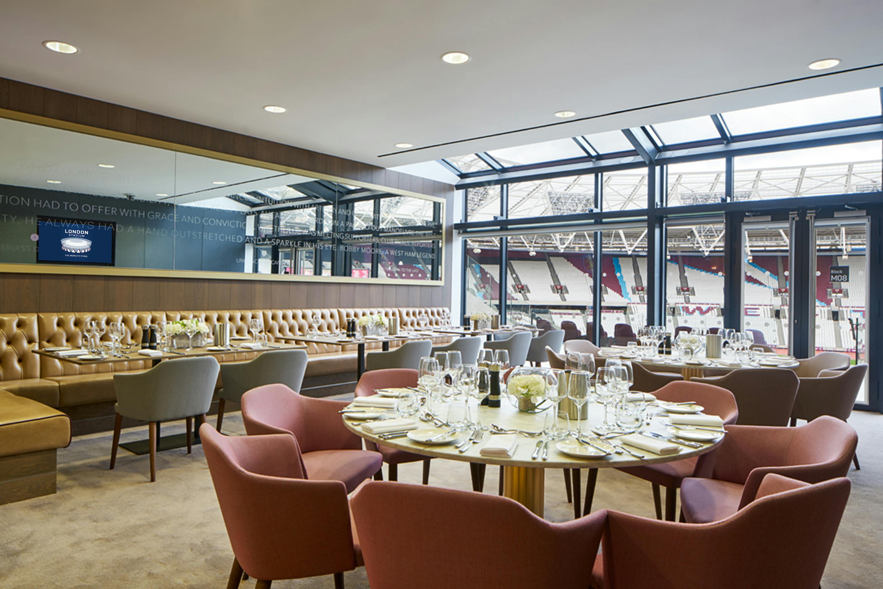 Elegant event space in London Stadium with fine dining setup for corporate and social gatherings.