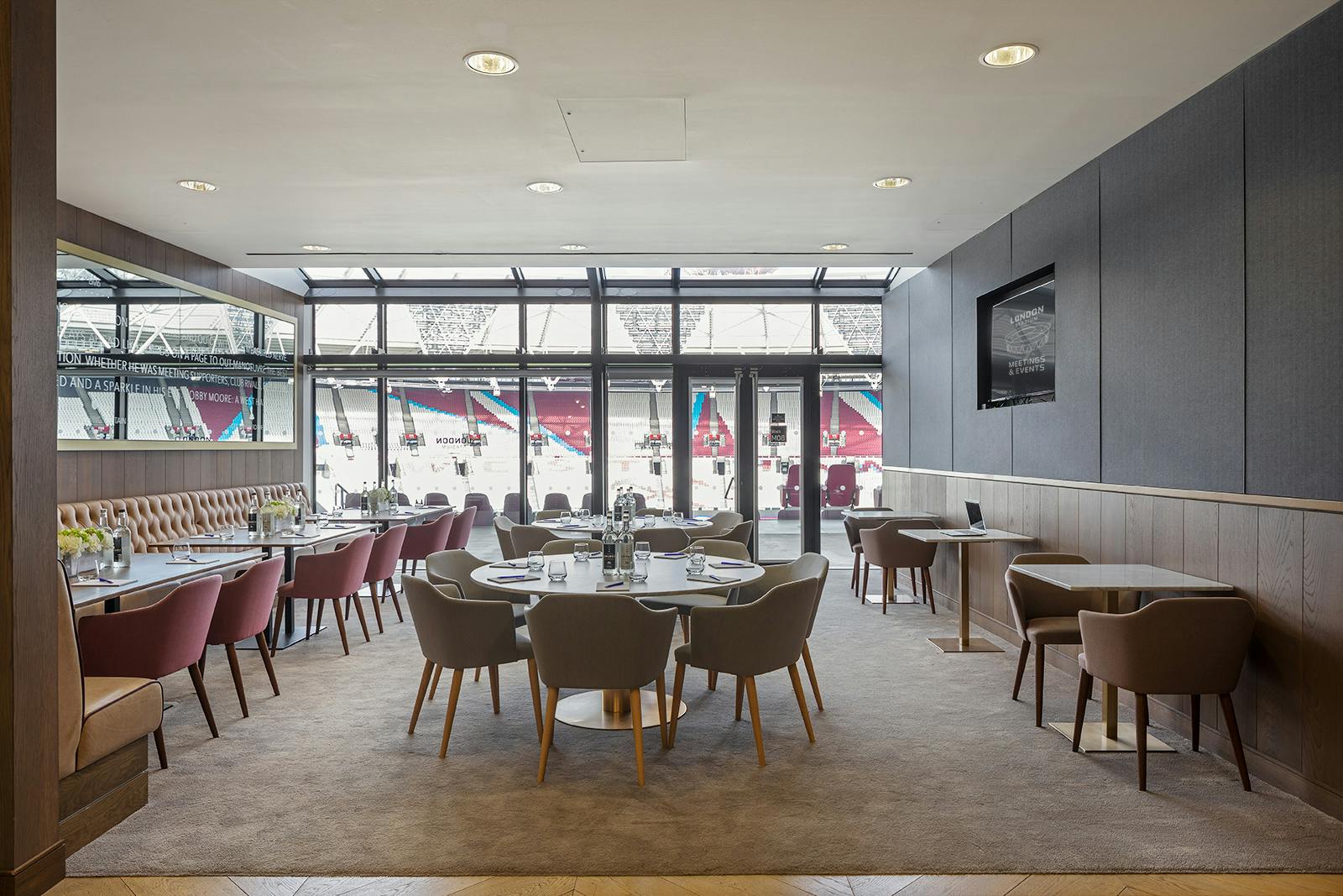 Modern event space in London Stadium with stylish seating for corporate meetings and private events.