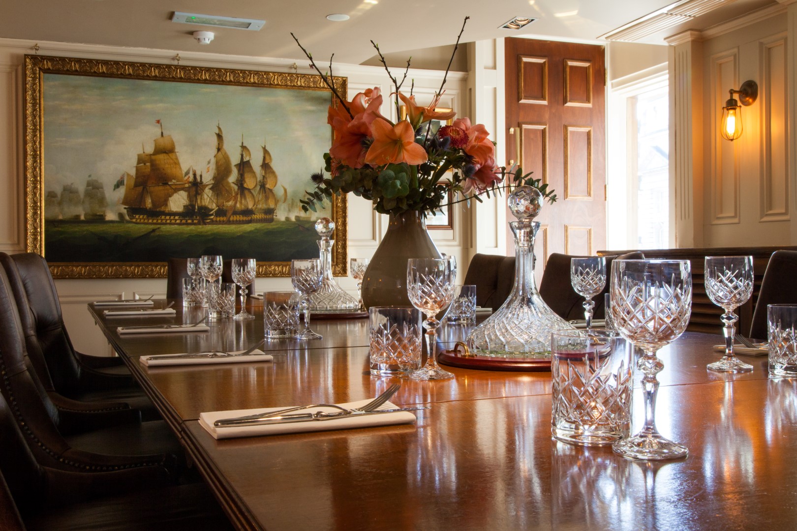Elegant dining table in The Admiral's Cabin for corporate dinners and intimate gatherings.