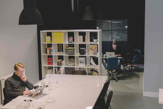 Modern workspace with large table for collaborative meetings and brainstorming sessions.