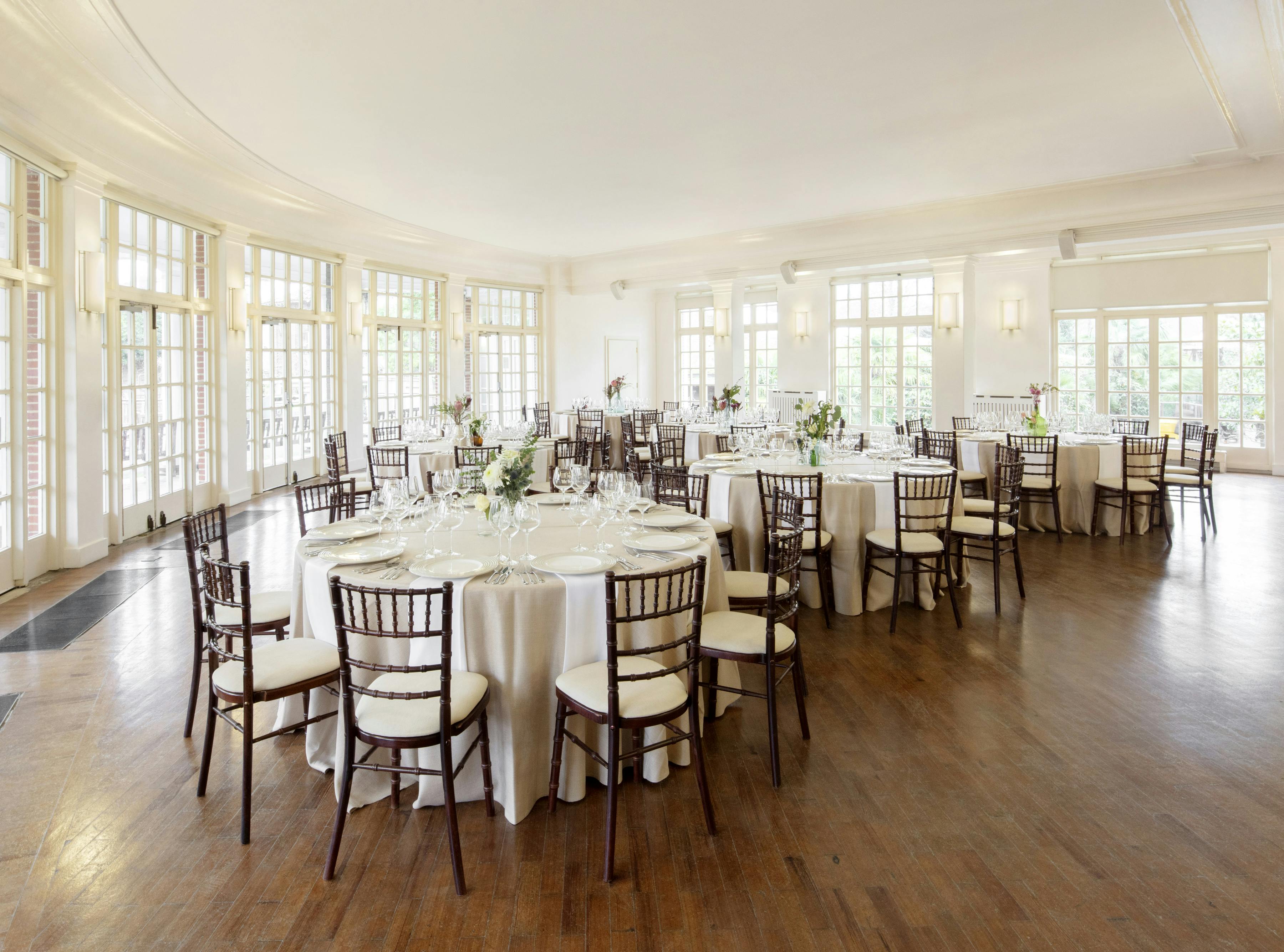 Mappin Pavilion at ZSL London Zoo, elegant event space with natural light and round tables.