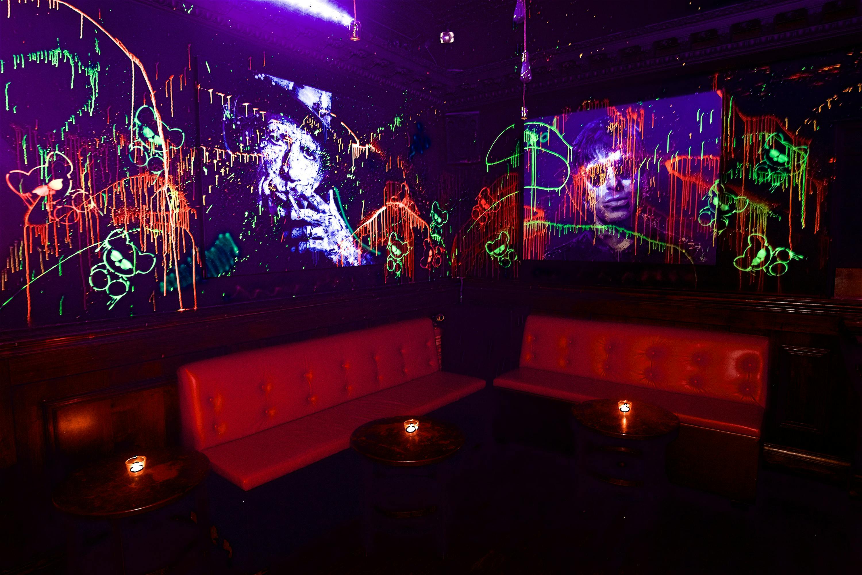 Neon-lit toy room with graffiti art, perfect for creative networking events.