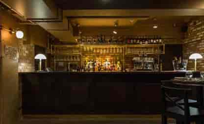 Stylish bar at Perini & Perini, perfect for networking events and intimate gatherings.