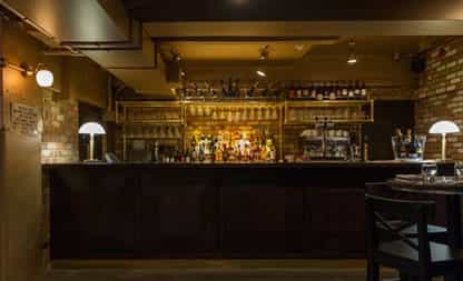 Stylish bar at Perini & Perini, perfect for networking events and intimate gatherings.