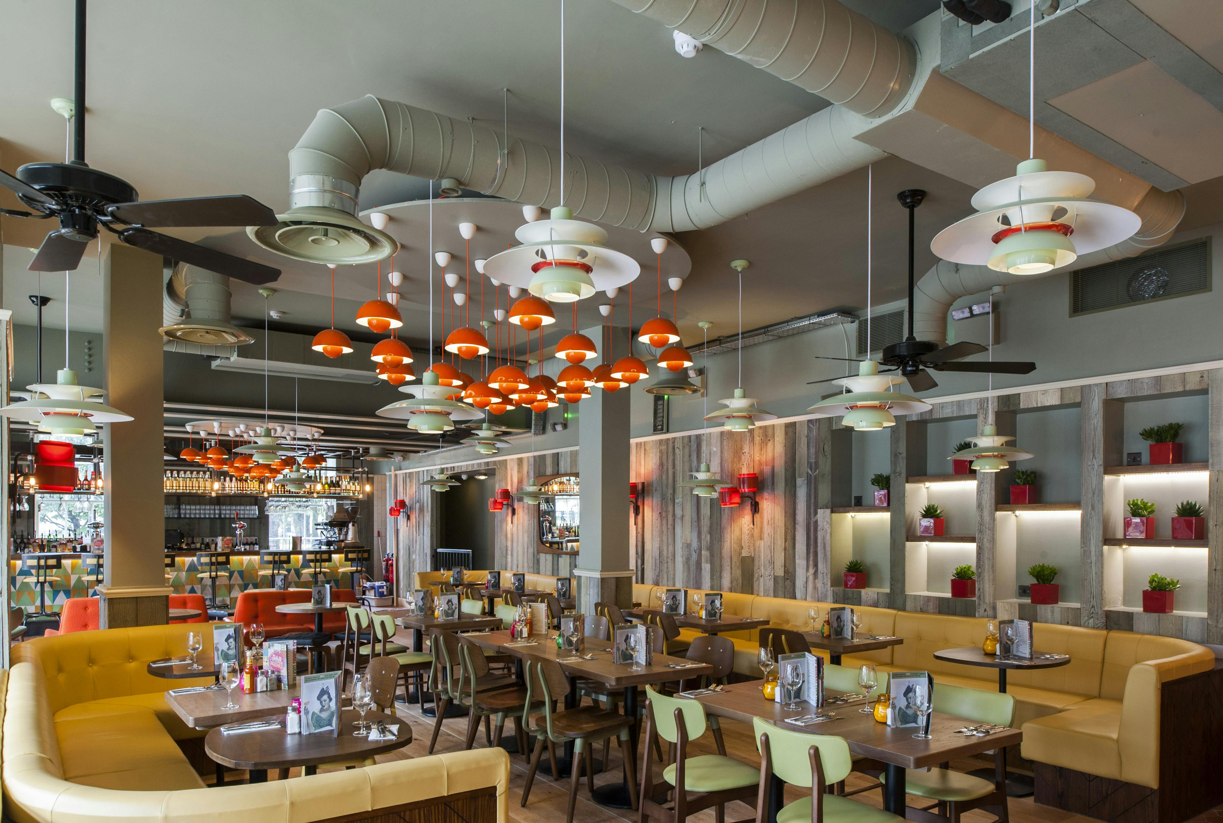 Vibrant Las Iguanas Edinburgh basement room for events with flexible seating and natural light.