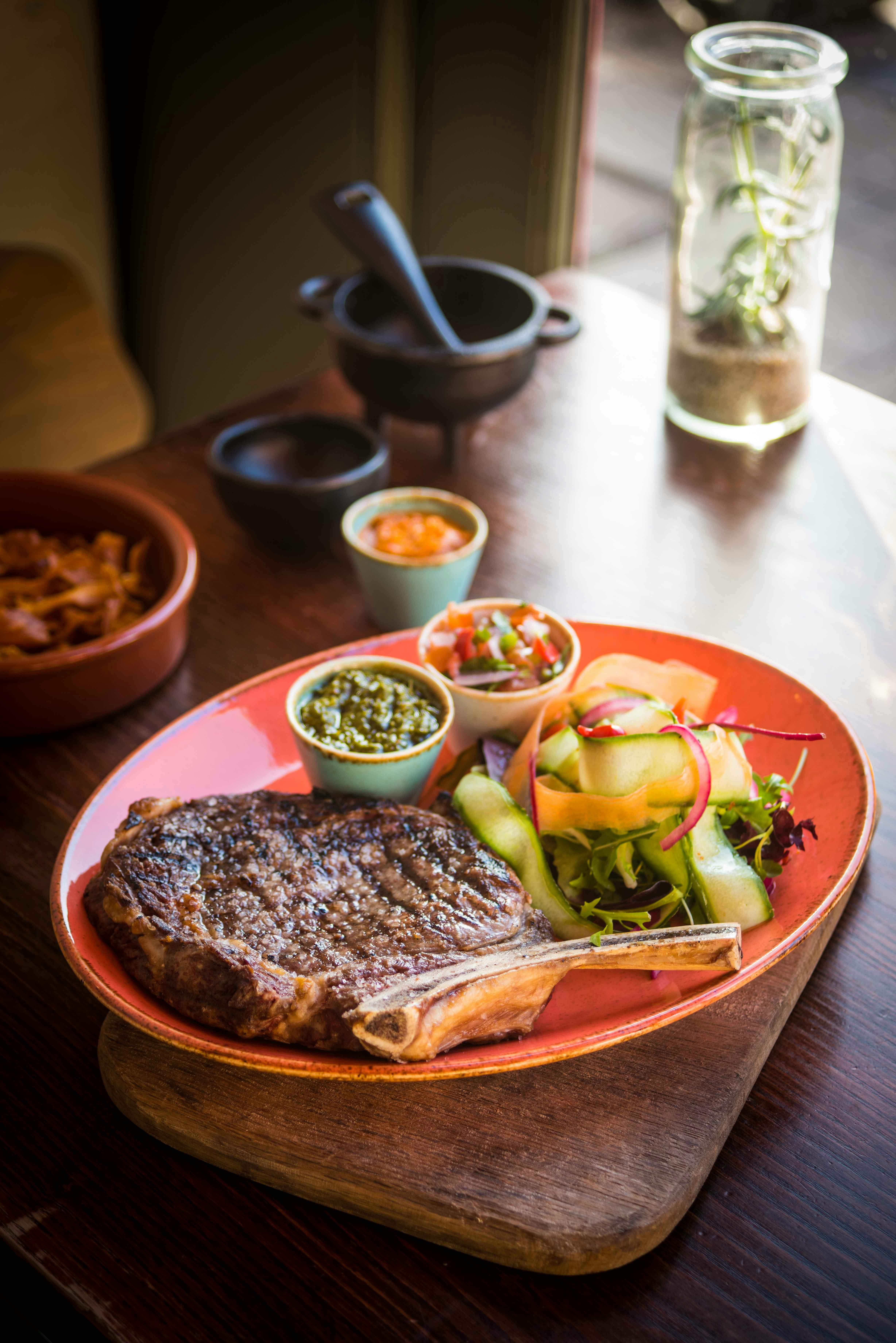 Grilled steak with salad and salsas in Las Iguanas Edinburgh event catering.