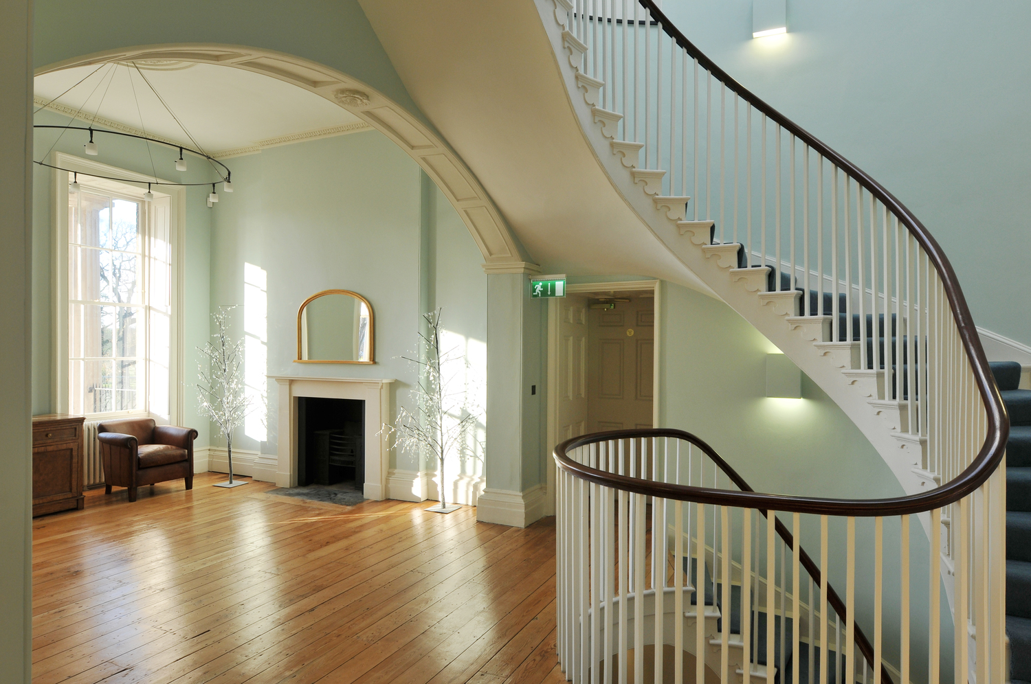 Elegant Drawing Room in Clissold House with sweeping staircase, perfect for events and receptions.