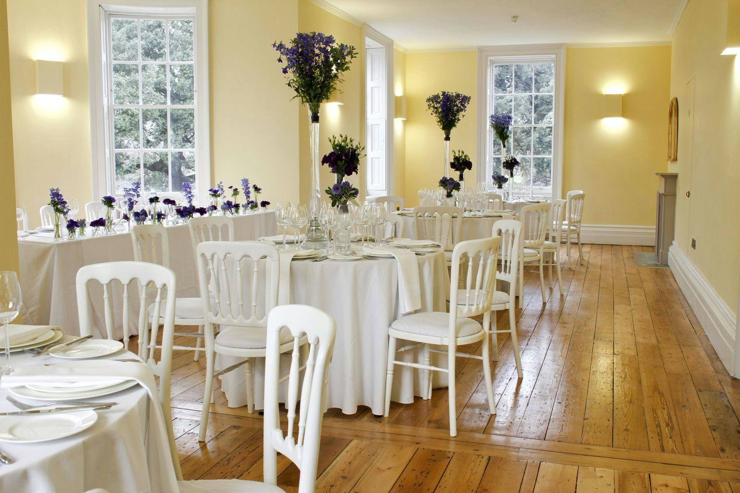 Elegant event space in Clissold House with round tables, ideal for weddings and gatherings.