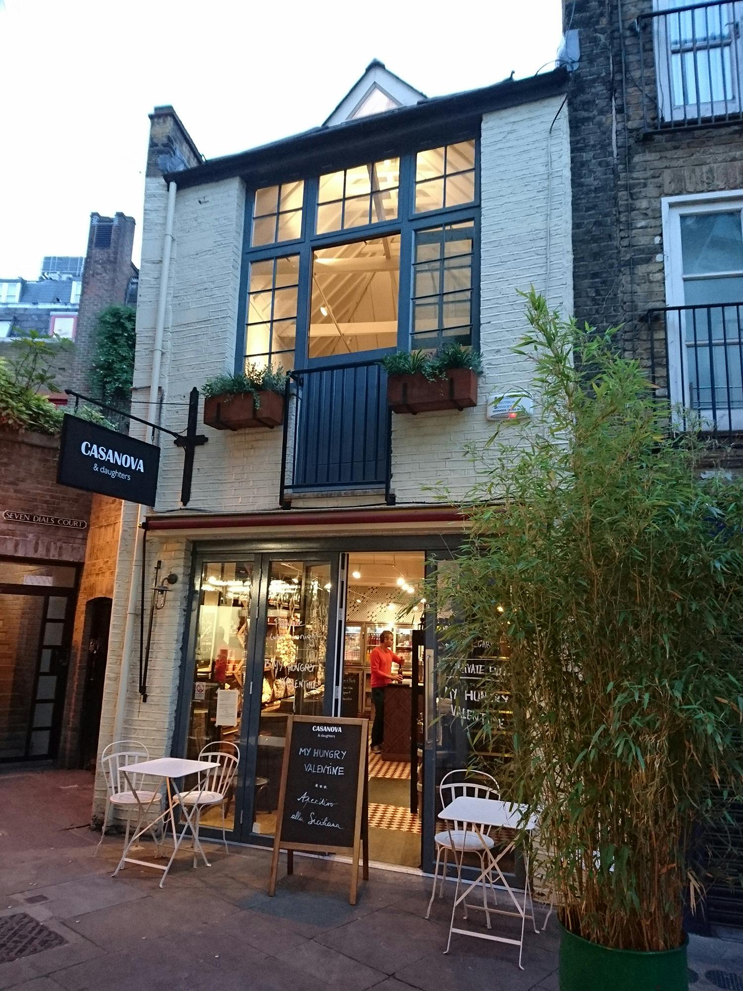 Charming wine bar exterior with large windows, perfect for intimate events and gatherings.