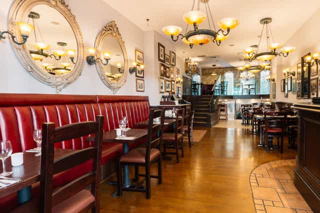 Stylish Bella Italia Strand venue with warm lighting for intimate gatherings and events.
