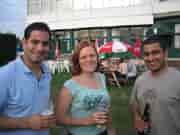 Outdoor networking event at Dragon's & Lion's Suites, featuring engaged attendees and ample seating.