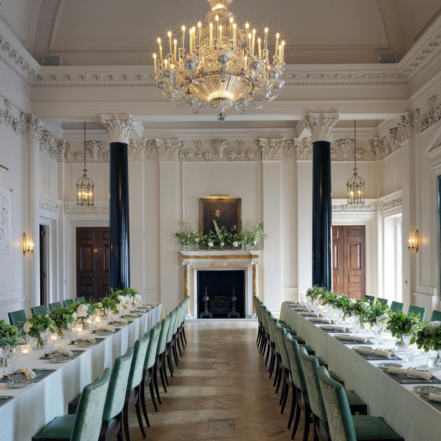 Elegant dining room at The Ned, featuring floral centerpieces for formal events.