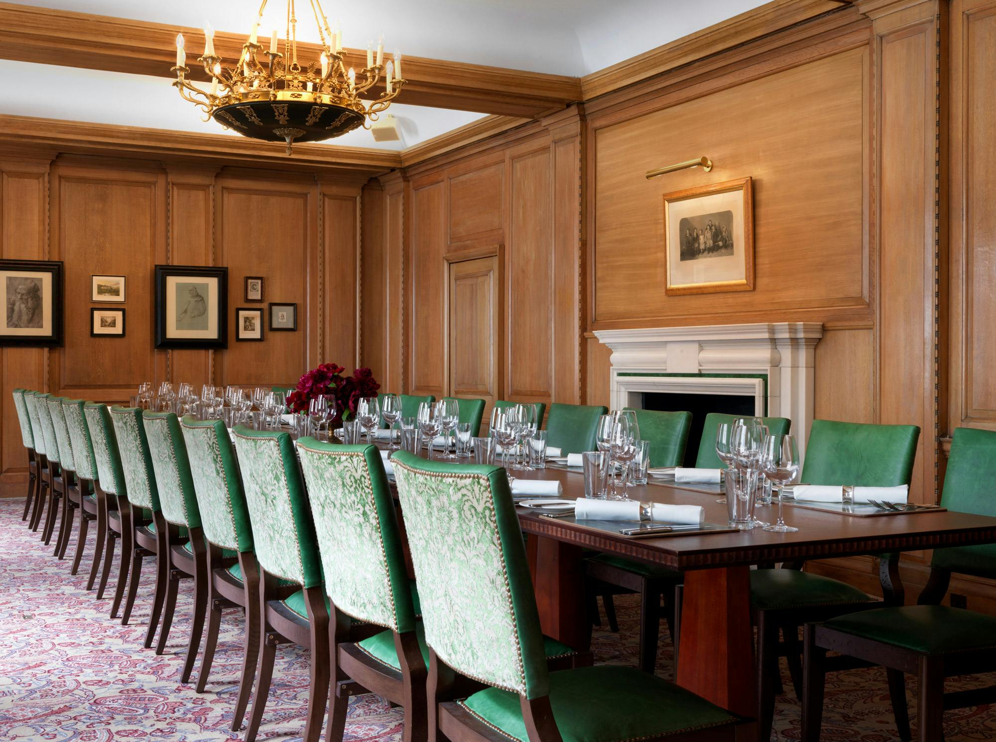 Sophisticated meeting room with wooden paneling, ideal for corporate events and dinners.