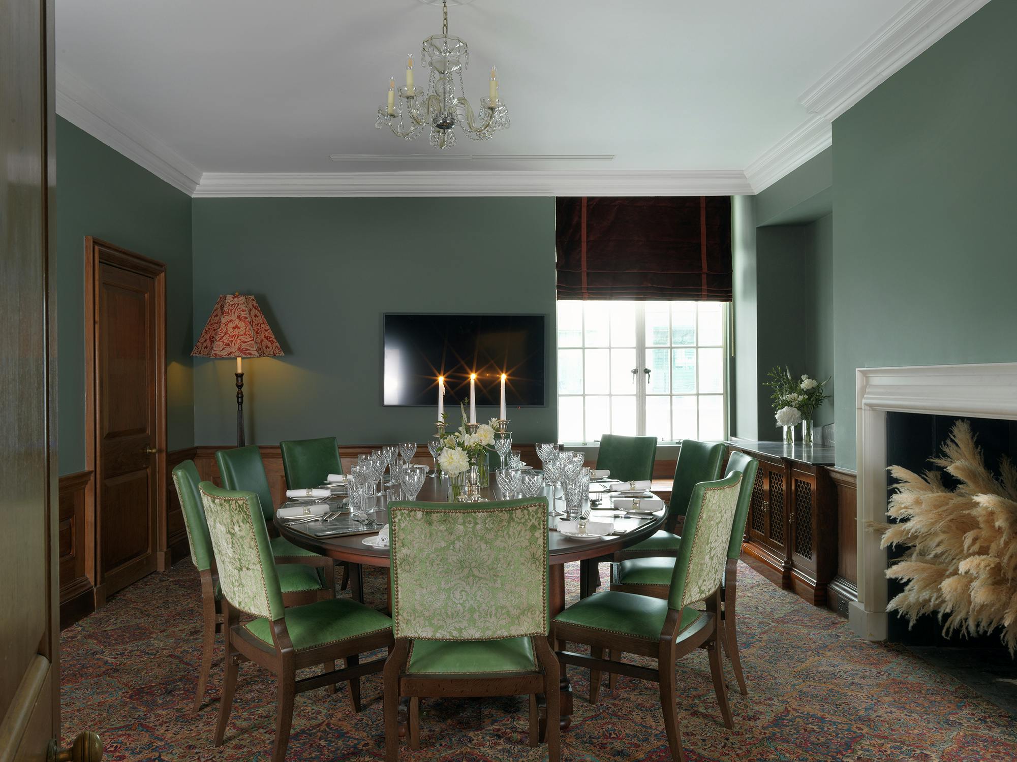 Sophisticated Wren Room at The Ned, featuring a round table for upscale meetings.