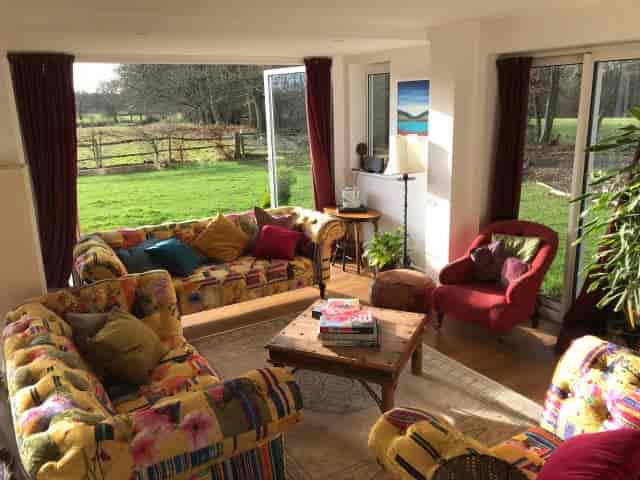 Cozy lounge area in A Sussex House, ideal for meetings and team-building activities.
