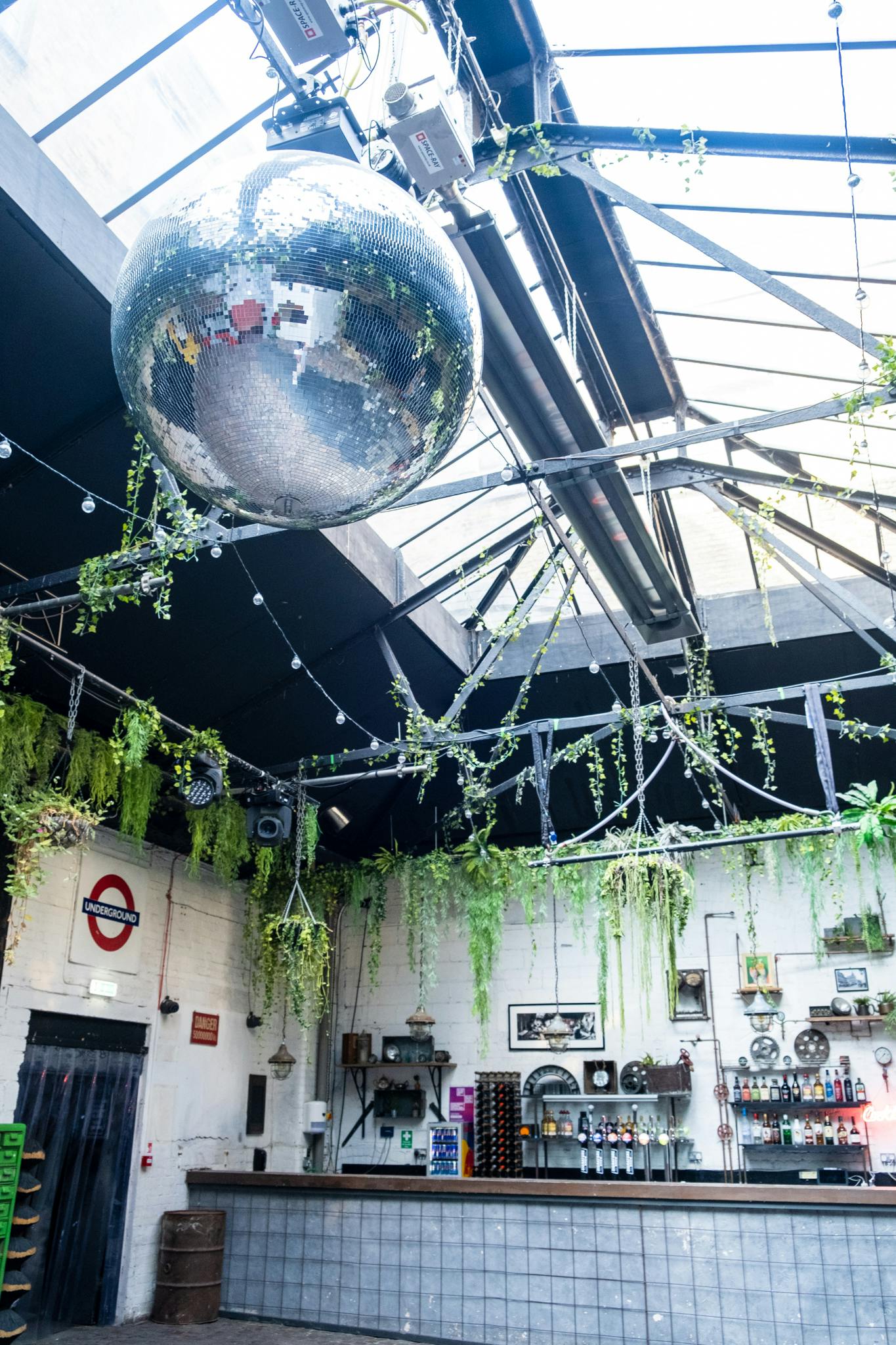 Electrowerkz Courtyard: industrial event space with greenery, perfect for social gatherings.